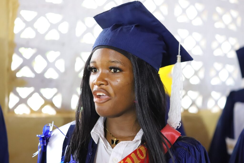 CASS graduate in blue academic gown